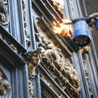 Final touches of patina to the north door replica before the inauguration